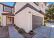 Charming two-story home with a well-manicured lawn, inviting front door, and garage at 10166 Monks Hood Ct, Las Vegas, NV 89183