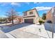 Charming two-story home with a well-maintained lawn and a spacious two-car garage at 10166 Monks Hood Ct, Las Vegas, NV 89183
