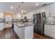 Modern kitchen featuring a center island, sleek appliances, and stylish backsplash at 10166 Monks Hood Ct, Las Vegas, NV 89183