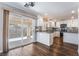 Modern kitchen with white cabinets, stainless steel appliances, and dark countertops at 10166 Monks Hood Ct, Las Vegas, NV 89183