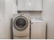 Functional laundry room featuring modern washer and dryer units at 10166 Monks Hood Ct, Las Vegas, NV 89183
