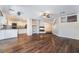 Inviting living room seamlessly connects to a modern kitchen with sleek countertops and appliances at 10166 Monks Hood Ct, Las Vegas, NV 89183