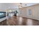 Open concept living space blending a modern kitchen and a dining area with cozy fireplace at 10166 Monks Hood Ct, Las Vegas, NV 89183