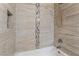 Shower featuring sleek tile design, with built in soap nook, and showerhead at 10166 Monks Hood Ct, Las Vegas, NV 89183