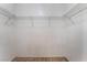 Spacious walk-in closet featuring durable carpet and metal shelving for efficient storage solutions at 10166 Monks Hood Ct, Las Vegas, NV 89183