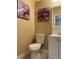 Bathroom features a single sink vanity and toilet and neutral wall color with flower art at 10238 Missouri Meadows St, Las Vegas, NV 89183