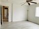 Spacious bedroom with a ceiling fan, light walls and wood-look floors at 10238 Missouri Meadows St, Las Vegas, NV 89183