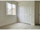 Neutral bedroom with wood flooring, window, and large closet at 10238 Missouri Meadows St, Las Vegas, NV 89183