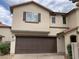 Inviting two-story home featuring a two-car garage and well-maintained landscaping at 10238 Missouri Meadows St, Las Vegas, NV 89183