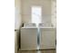 Dedicated laundry room with white washer and dryer at 10238 Missouri Meadows St, Las Vegas, NV 89183
