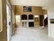 Bright living room showcasing a fireplace, built-in shelving, and easy access to the outdoors at 10238 Missouri Meadows St, Las Vegas, NV 89183