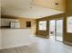 Open-concept living space featuring a kitchen with modern appliances and access to the backyard at 10238 Missouri Meadows St, Las Vegas, NV 89183