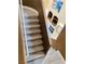 Light-colored wood stairs with white railing lead to the second level of this home at 10238 Missouri Meadows St, Las Vegas, NV 89183