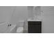 Bright bathroom featuring a vanity with dark cabinets, white countertop, mirror, toilet, and tub/shower combination at 10273 Fragrant Apple Ct, Las Vegas, NV 89141