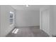 Bright bedroom featuring natural light, neutral carpet, and a closet at 10273 Fragrant Apple Ct, Las Vegas, NV 89141