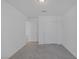 Bedroom with carpeted floors, closet and access to another room at 10273 Fragrant Apple Ct, Las Vegas, NV 89141