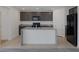 Modern kitchen featuring granite countertops, a central island, and stainless steel appliances at 10273 Fragrant Apple Ct, Las Vegas, NV 89141