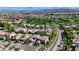 Scenic aerial view of a well-maintained neighborhood with lush trees and landscaping at 10389 Walking View Ct, Las Vegas, NV 89135