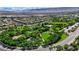 Aerial view of a community park with green spaces, recreation areas, and walking paths at 10389 Walking View Ct, Las Vegas, NV 89135