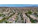 Expansive aerial view of a residential neighborhood with meticulously maintained homes, streets, and landscaping at 10389 Walking View Ct, Las Vegas, NV 89135