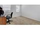 Spare bedroom with carpet flooring and neutral walls, with an office chair and desk at 10389 Walking View Ct, Las Vegas, NV 89135