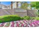 Beautiful Ivy Glen community sign with colorful flowers and lush green landscaping at 10389 Walking View Ct, Las Vegas, NV 89135