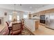 Bright kitchen with stainless steel appliances and tile flooring at 10389 Walking View Ct, Las Vegas, NV 89135