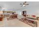 Open floor plan featuring the living room, dining area, and kitchen, filled with natural light at 10389 Walking View Ct, Las Vegas, NV 89135