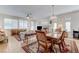 Bright living room featuring tile floors, elegant furniture, and lots of natural light at 10389 Walking View Ct, Las Vegas, NV 89135