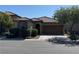 Charming single-story home featuring a well-manicured front yard and a two-car garage at 10590 Natural Bridge St, Las Vegas, NV 89179