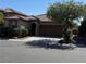 Charming single-story home featuring a well-manicured front yard and a two-car garage at 10590 Natural Bridge St, Las Vegas, NV 89179