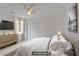 Virtually staged bedroom with neutral color palette, carpet, and natural light at 1421 Via Savona Dr, Henderson, NV 89052