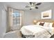 Charming bedroom with a plush bed, large window, and neutral decor at 1421 Via Savona Dr, Henderson, NV 89052