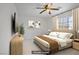 Comfortable bedroom featuring a plush bed, modern decor, and natural light at 1421 Via Savona Dr, Henderson, NV 89052
