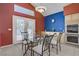 Eat-in kitchen featuring tile floors, glass table, and stainless steel double oven at 1421 Via Savona Dr, Henderson, NV 89052