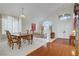 Bright dining room open to the living area with elegant furnishings and plenty of natural light at 1421 Via Savona Dr, Henderson, NV 89052