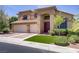 Charming two-story home featuring a three-car garage and well-maintained landscaping at 1421 Via Savona Dr, Henderson, NV 89052