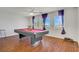 Game room featuring a billiard table, hardwood floors, and natural light at 1421 Via Savona Dr, Henderson, NV 89052