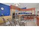 Bright kitchen with wood cabinets, stainless steel appliances, and an adjacent dining area at 1421 Via Savona Dr, Henderson, NV 89052