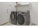 Laundry room featuring front load washer and dryer units and upper shelf at 1421 Via Savona Dr, Henderson, NV 89052
