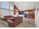 Open-concept living space with a breakfast bar, seamless flow to the kitchen, and large windows at 1421 Via Savona Dr, Henderson, NV 89052