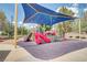 Community playground with shade cover, slides, and soft surface for safety at 1421 Via Savona Dr, Henderson, NV 89052