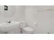 Powder room featuring a modern pedestal sink and toilet at 1421 Via Savona Dr, Henderson, NV 89052