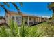 Charming home showcasing a covered patio and lush landscaping, offering a serene outdoor space for relaxation and enjoyment at 1574 Livingston Dr, Henderson, NV 89012