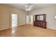 Large primary bedroom featuring hardwood floors, ceiling fan, and vintage dresser at 1574 Livingston Dr, Henderson, NV 89012