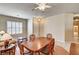 Charming dining area with wood table, seating for four, and bright natural lighting at 1574 Livingston Dr, Henderson, NV 89012