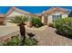 Charming single-story house with desert landscaping and a sidewalk leading to the front door at 1574 Livingston Dr, Henderson, NV 89012