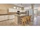 Bright kitchen with white cabinets, a center island, and stainless steel appliances at 1574 Livingston Dr, Henderson, NV 89012