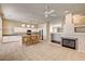 Open concept living area with a fireplace, kitchen access and tile floors at 1574 Livingston Dr, Henderson, NV 89012