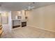 Living room featuring a decorative fireplace, neutral walls, and tile floors at 1574 Livingston Dr, Henderson, NV 89012